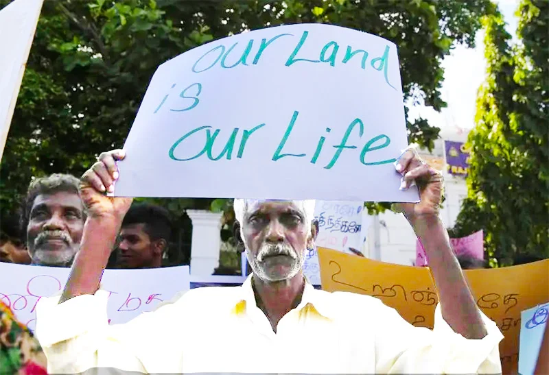 A file photo of a demonstration in Colombo, demanding the release of land held by the military in the former warzone. (Image courtesy of Eranga Jayawardena/AP)